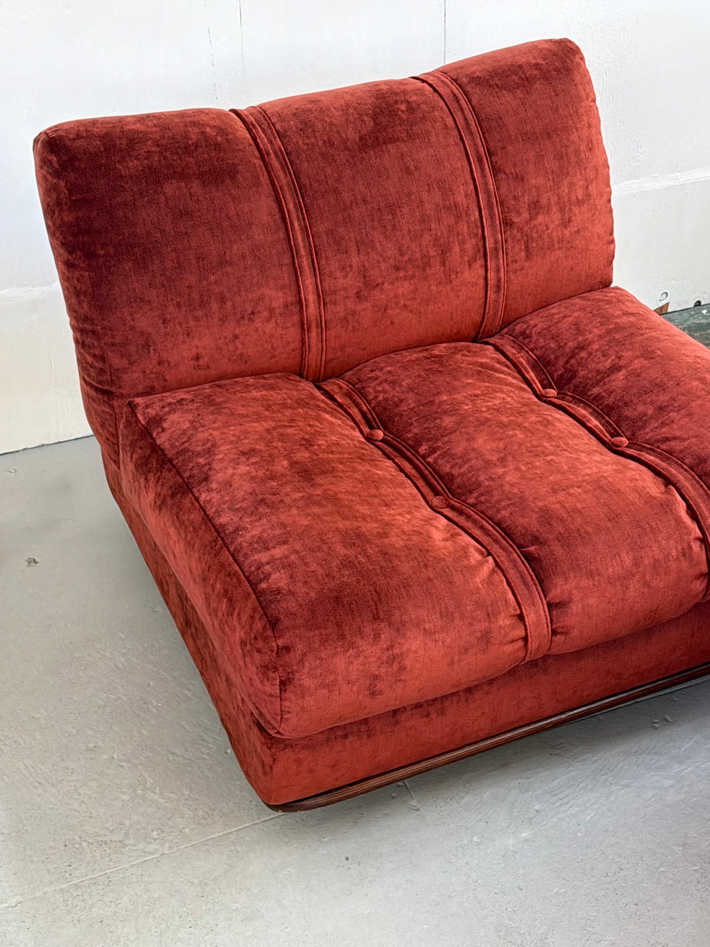 Detail of walnut bentwood frame and maroon velvet upholstery