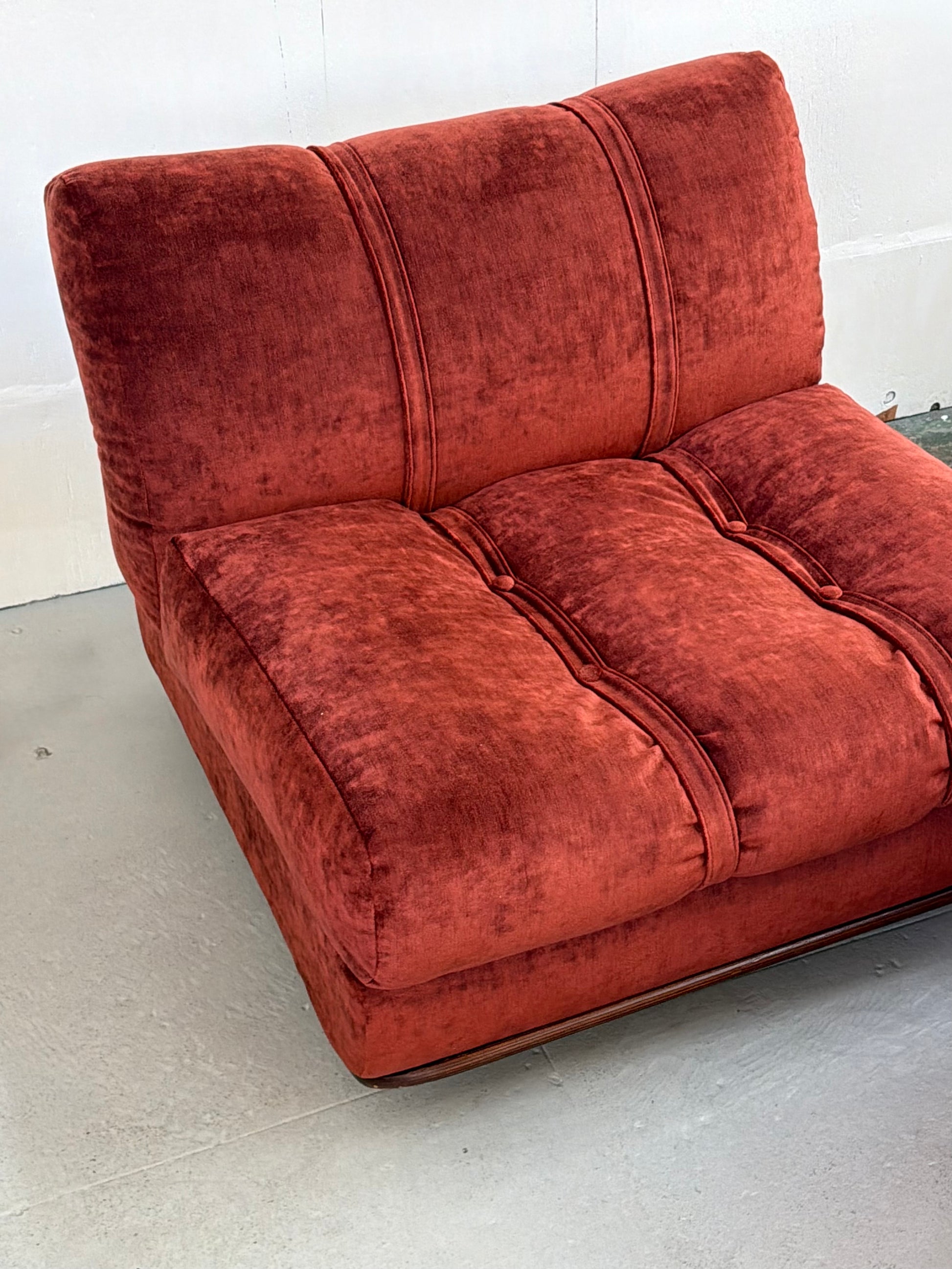 Detail of walnut bentwood frame and maroon velvet upholstery
