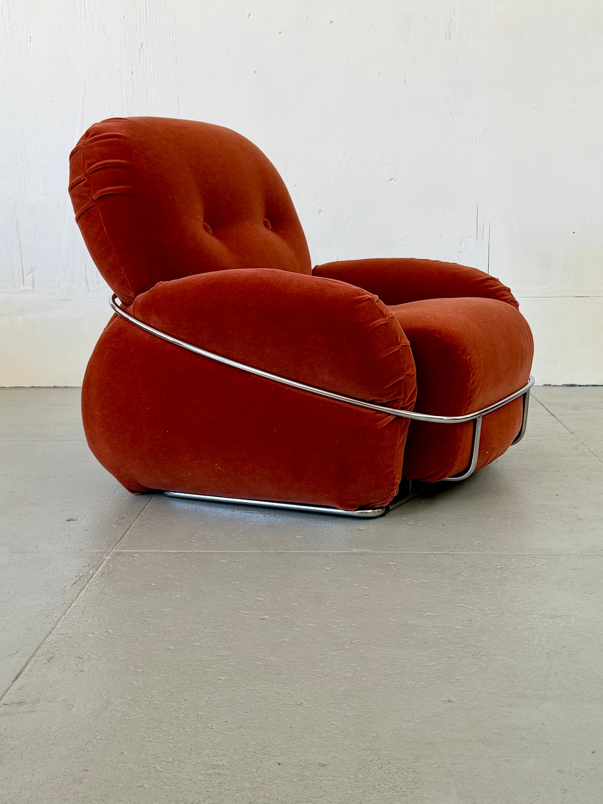 Detail of chrome frame and rose mohair upholstery on Adriano Piazzesi 'Okay' chair