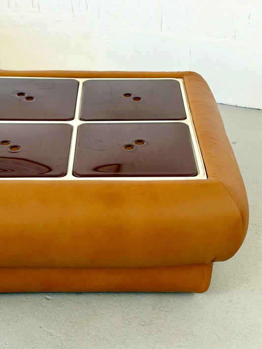 Leather Nuvolone coffee table with four leather-and-lucite storage compartments, front view